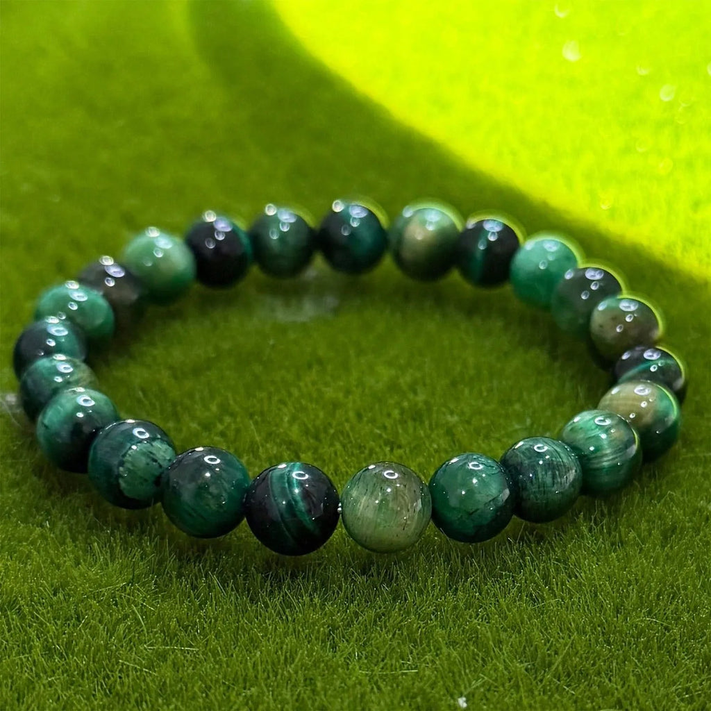 Handmade green opal glass beaded bracelet on a white background