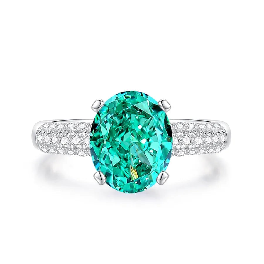 S925 sterling silver women's ring with ellipse emerald and inlaid high carbon diamond in geometric setting.