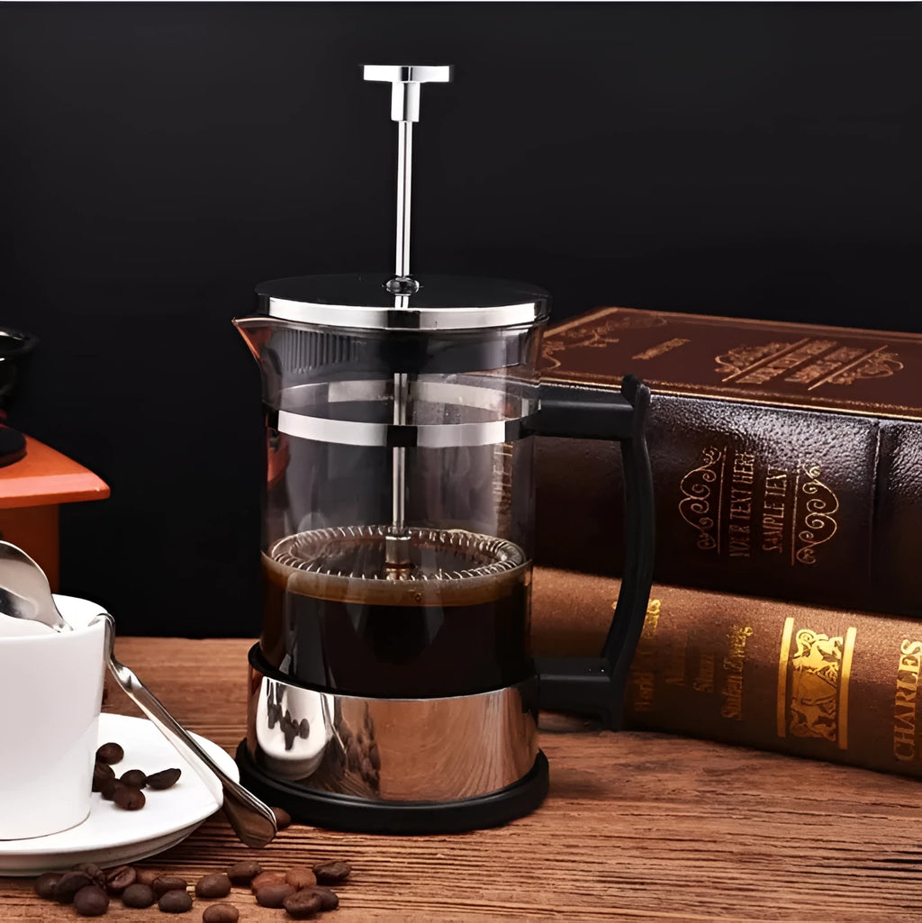 Compact glass French press coffee maker with stainless steel frame, 350ml capacity.