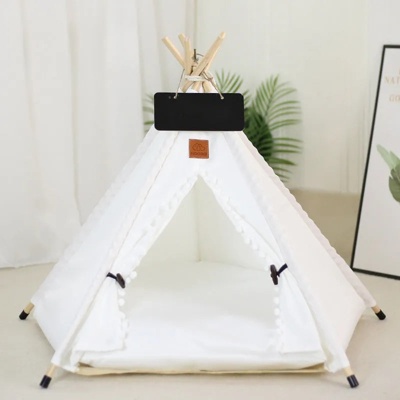 Striped flax and linen teepee tent pet bed for a small dog or cat, shown with a cushion inside.