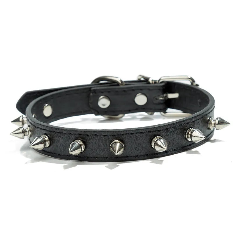 Close-up of a studded black PU leather dog collar with metal spikes and a silver alloy buckle fastener.