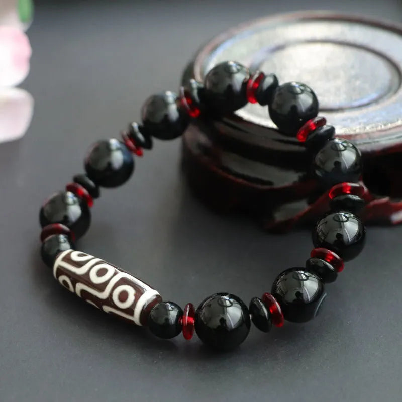 Hand-woven black agate Dzi bead bracelet with 11mm geometric chalcedony beads