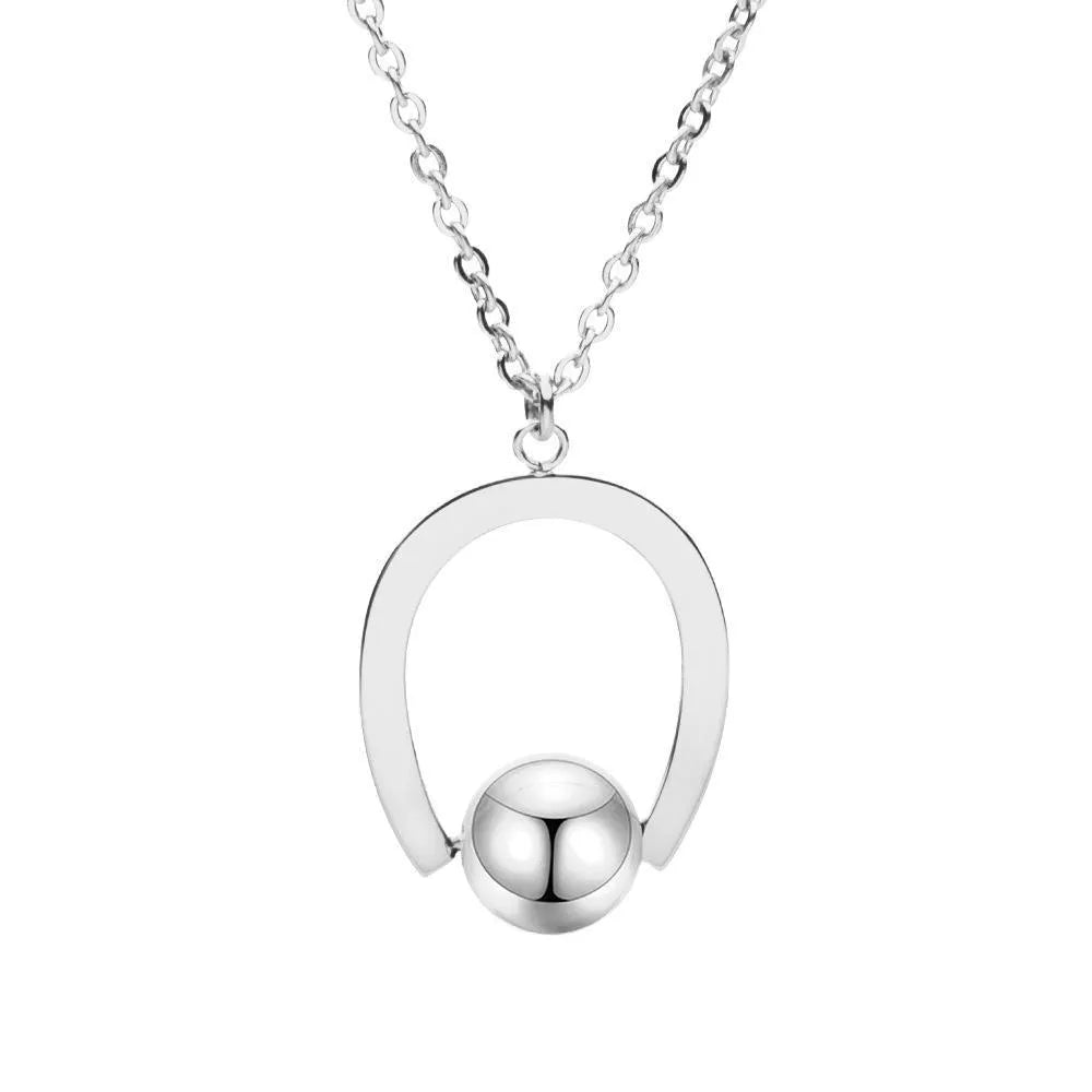 Gold and silver stainless steel necklace with geometric pendant on a cross chain, adjustable length.