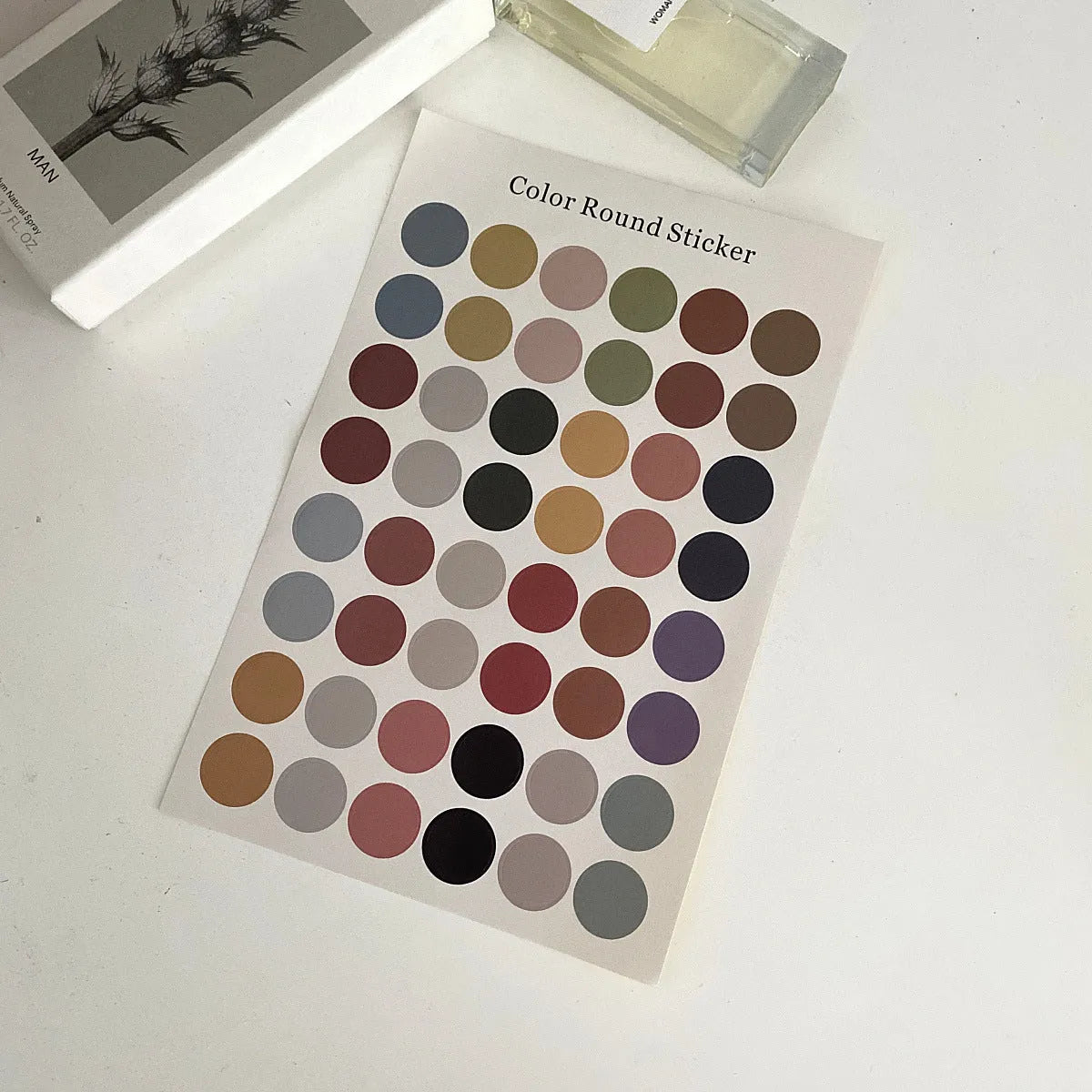 Sheet of 48 Morandi earth colour polka dot seal stickers, each 2cm diameter, on a 16x24.5cm sheet