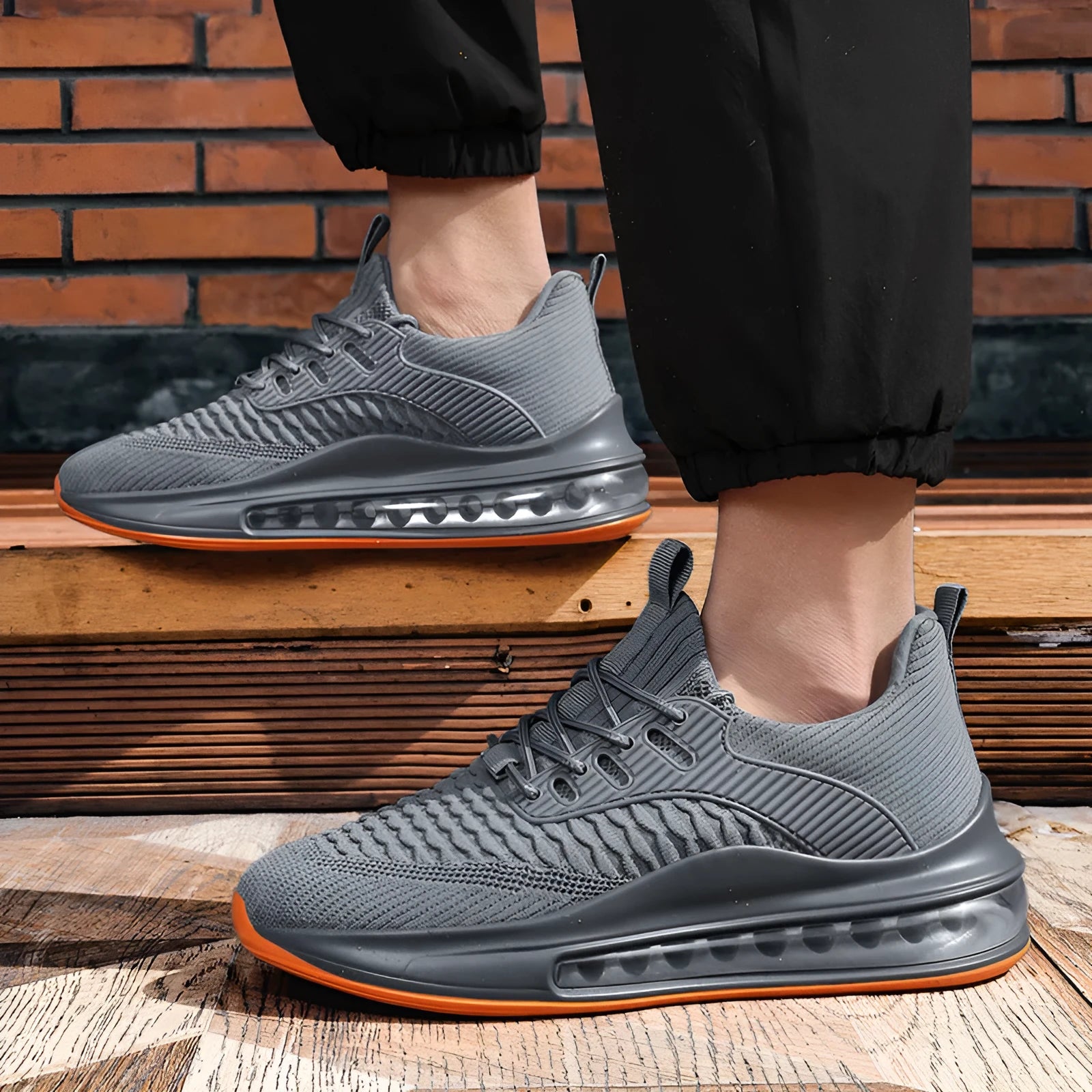 Men's low-top black mesh running shoes with white rubber sole and lace-up front.