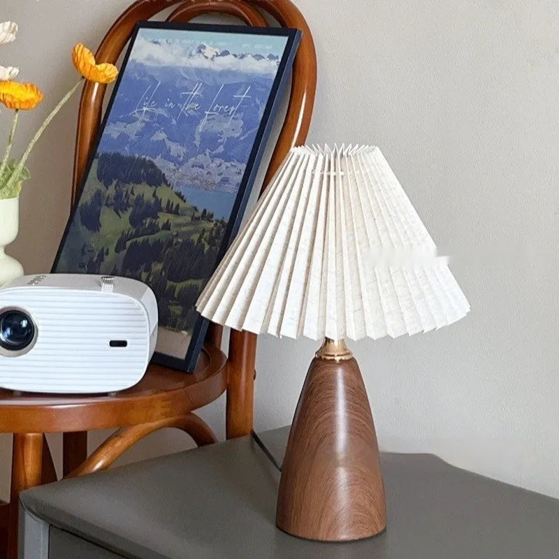Nordic retro ceramic table lamp with pleated shade and remote control on bedside table