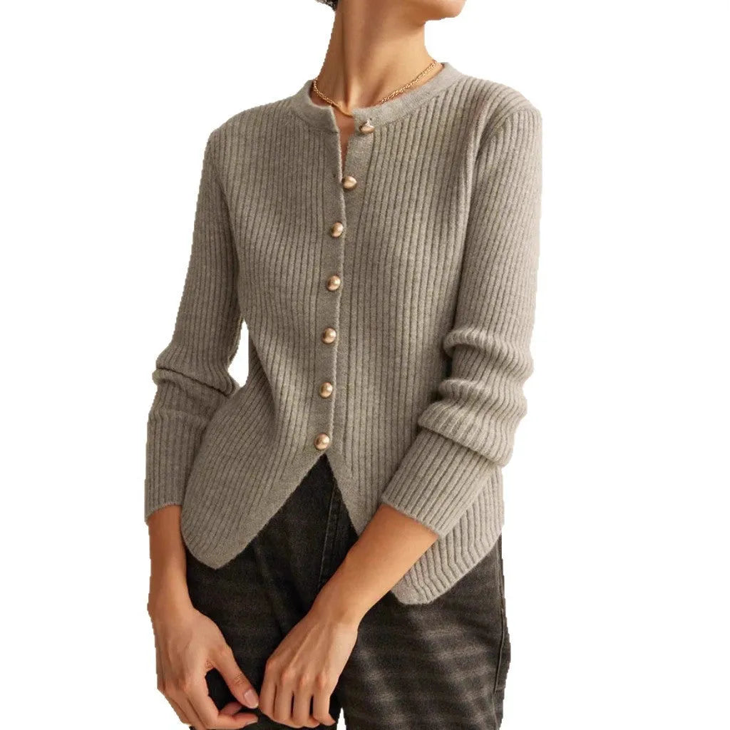 Red loose-fit cardigan sweater with a yarn collar on a hanger