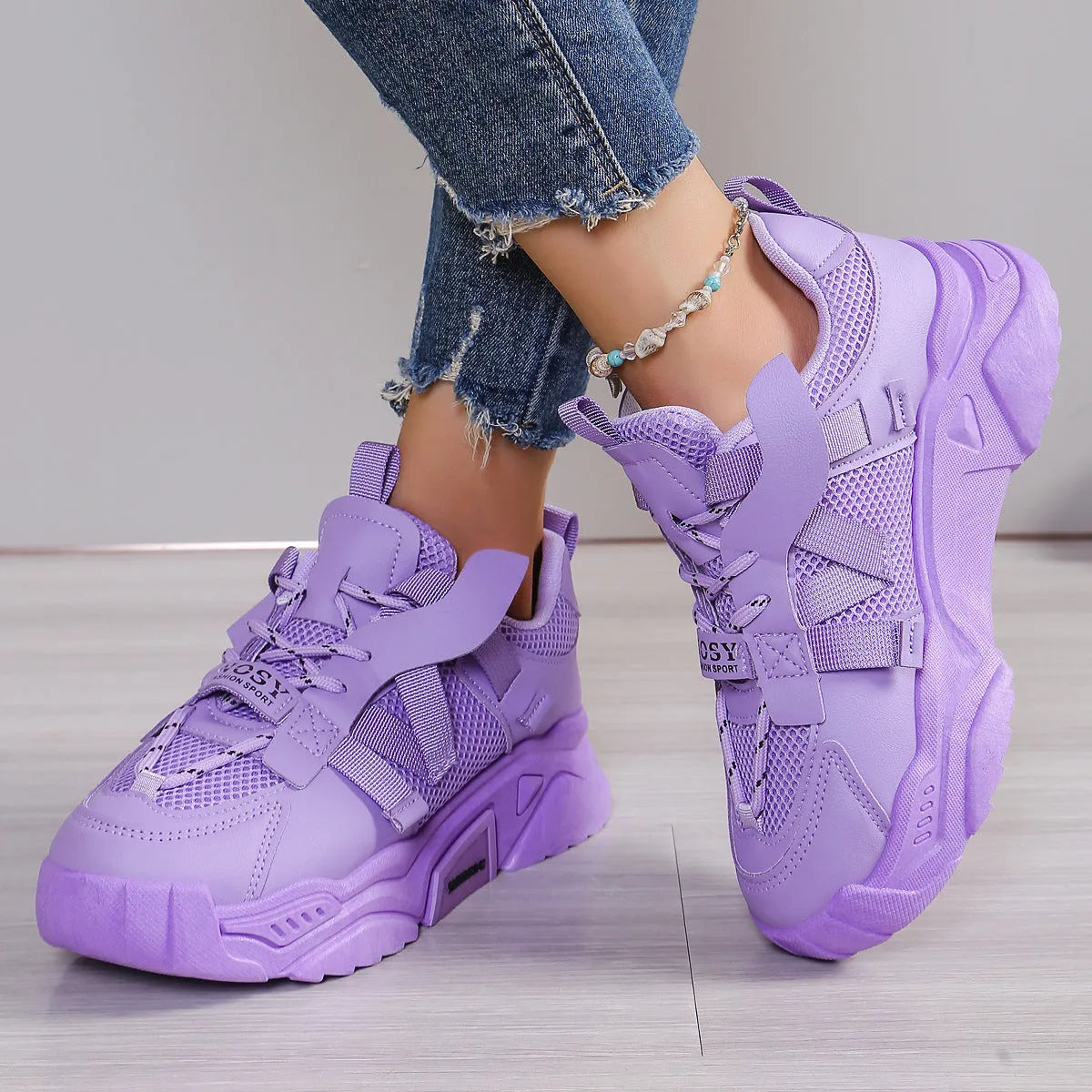 Women's purple platform mesh dad shoes with lace-up front and thick sole.
