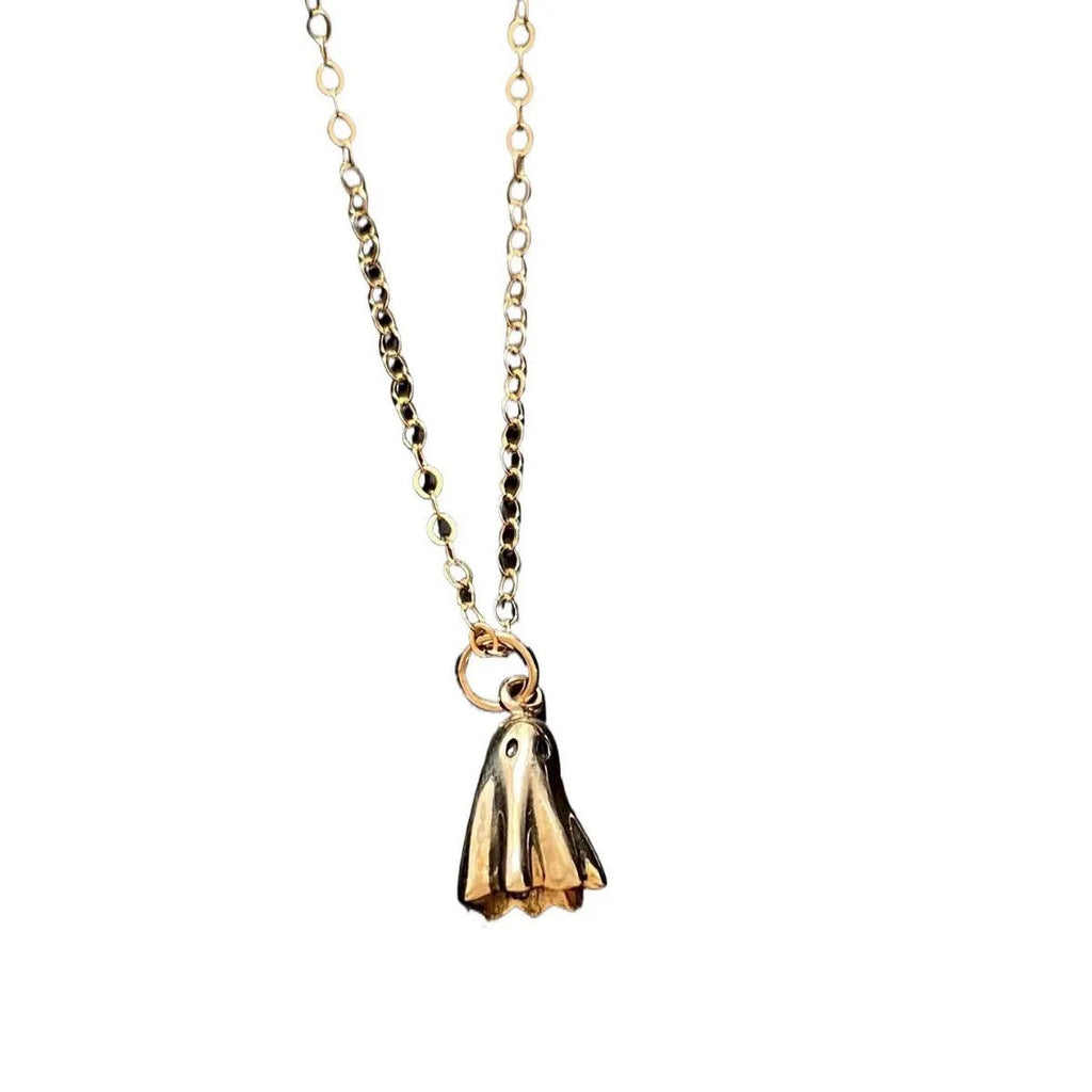 A modern ghost pendant necklace on a stainless steel chain, showing the titanium steel electroplated pendant detail.