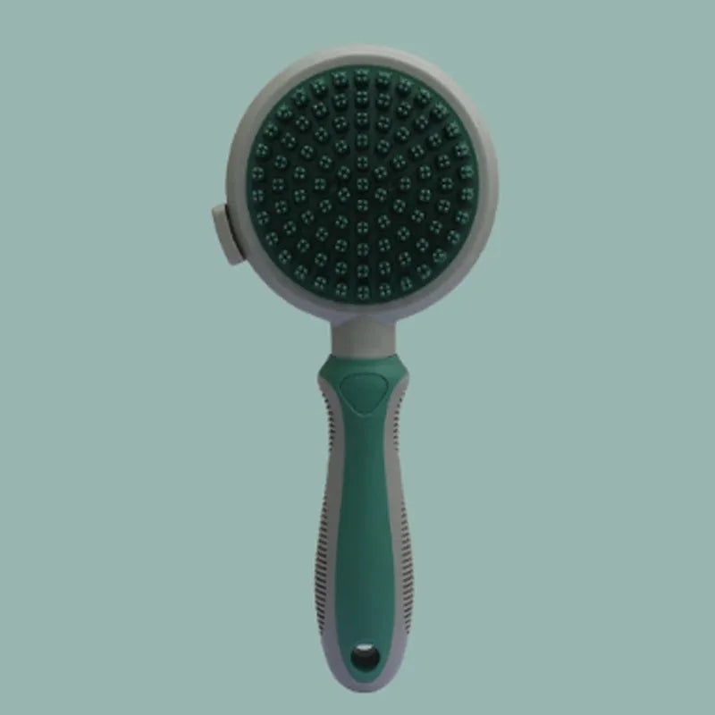 Green and pink two-sided silicone pet grooming brush with slicker brush and massage head on a white background