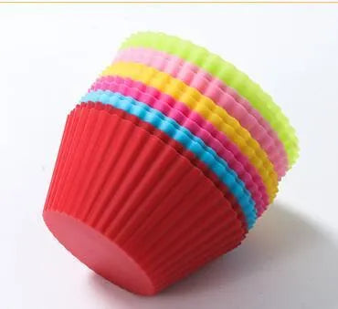 Twelve reusable silicone cupcake liners in six colours, two cups per colour, with a nonstick surface.