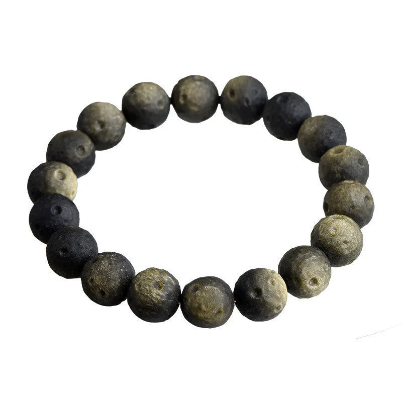 Unisex natural obsidian crater ball bracelet in silver stone meteorite colour with textured beads.