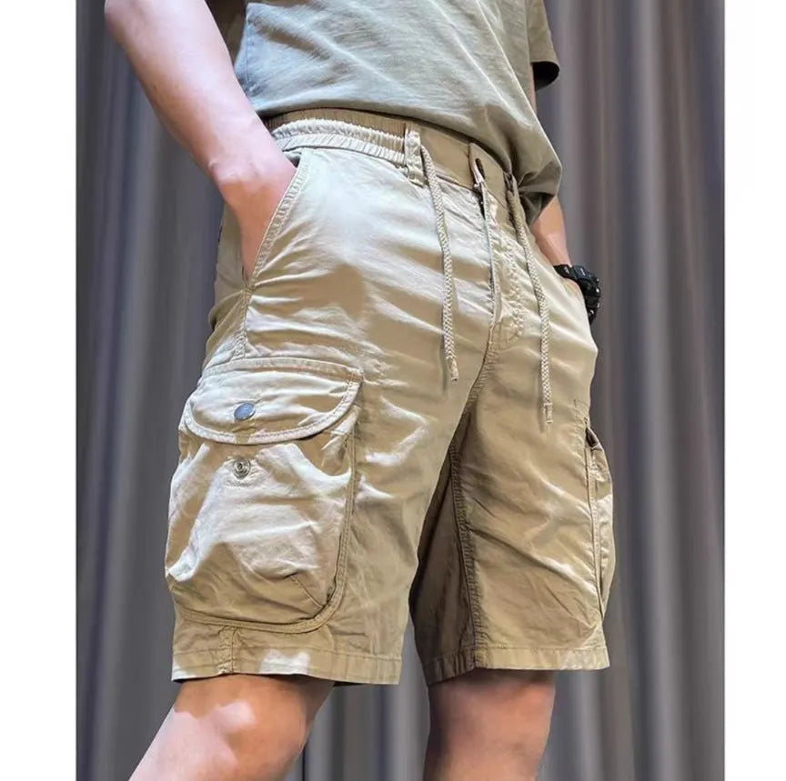 Korean style loose straight-leg overalls in khaki with multiple pockets and elasticated waistband.