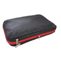 Green travel compression storage bag made of waterproof nylon in cube shape on a white background