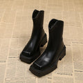 Black and brown women's square toe platform Martin boots with a mid calf height and back zipper.
