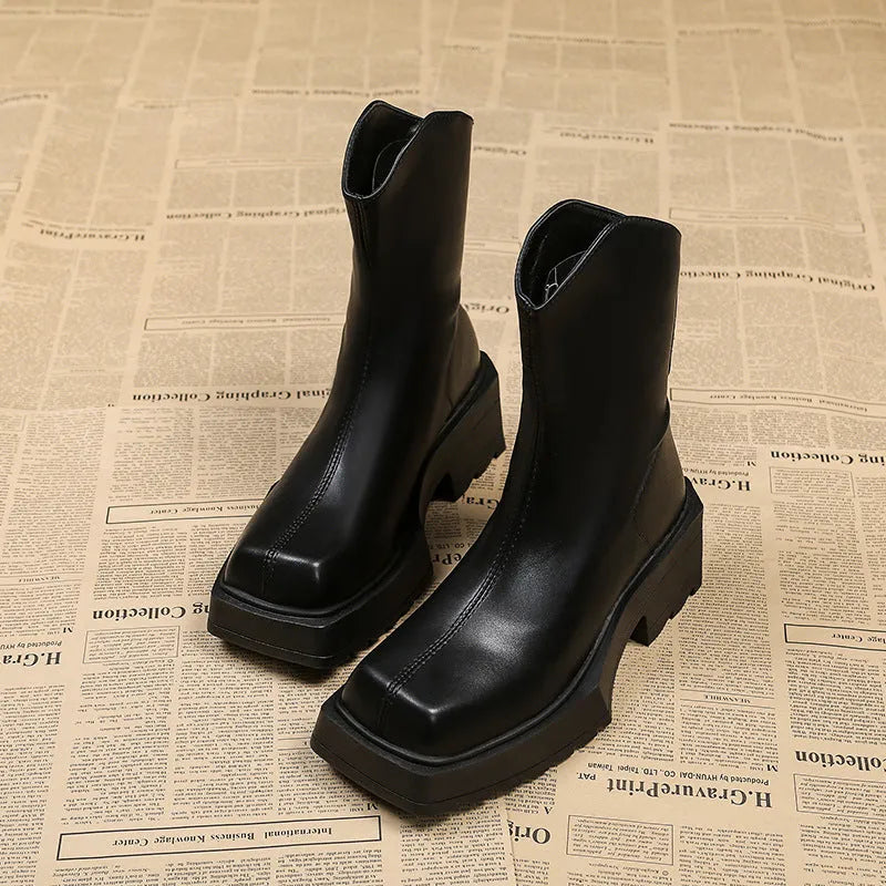 Black and brown women's square toe platform Martin boots with a mid calf height and back zipper.