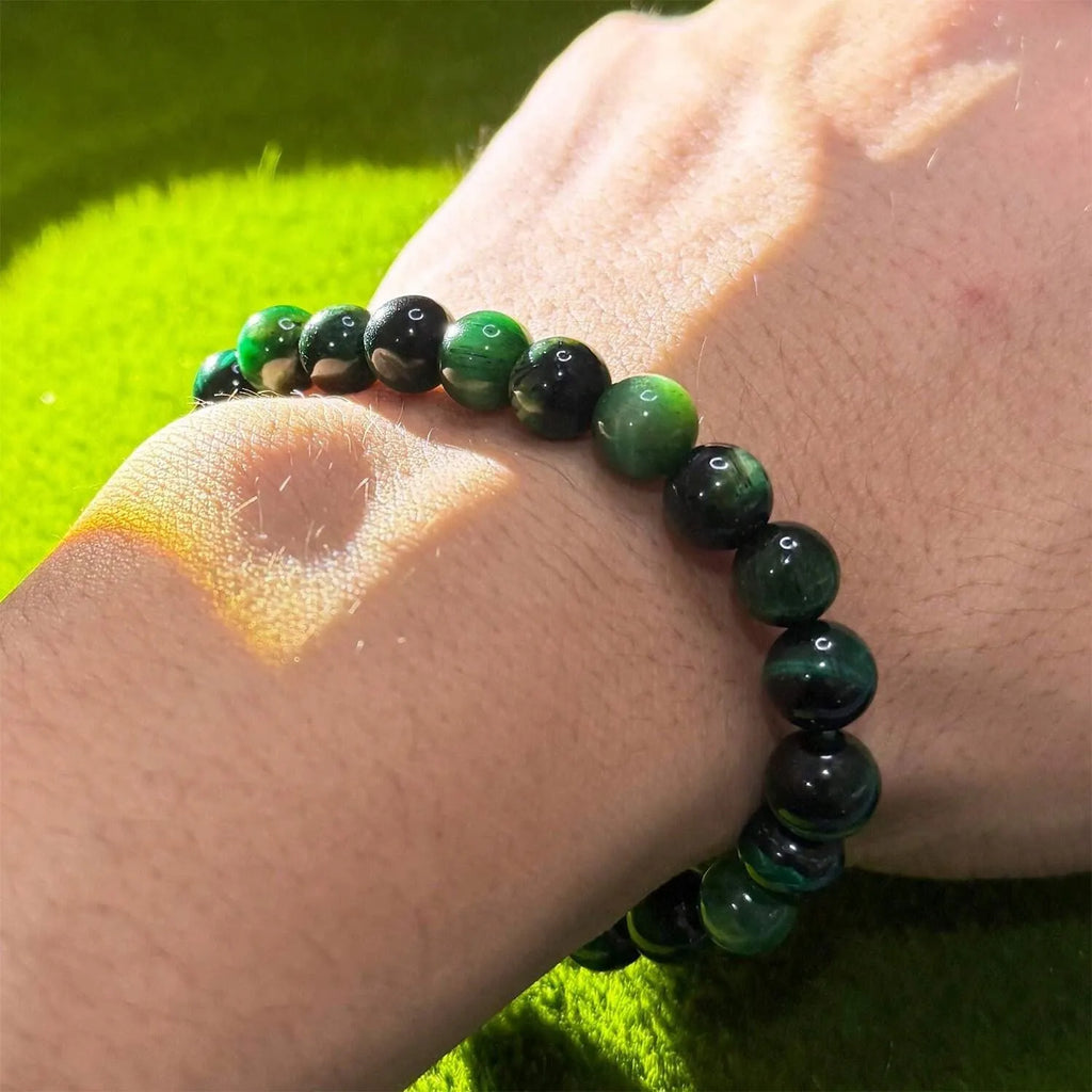 Handmade green opal glass beaded bracelet on a white background