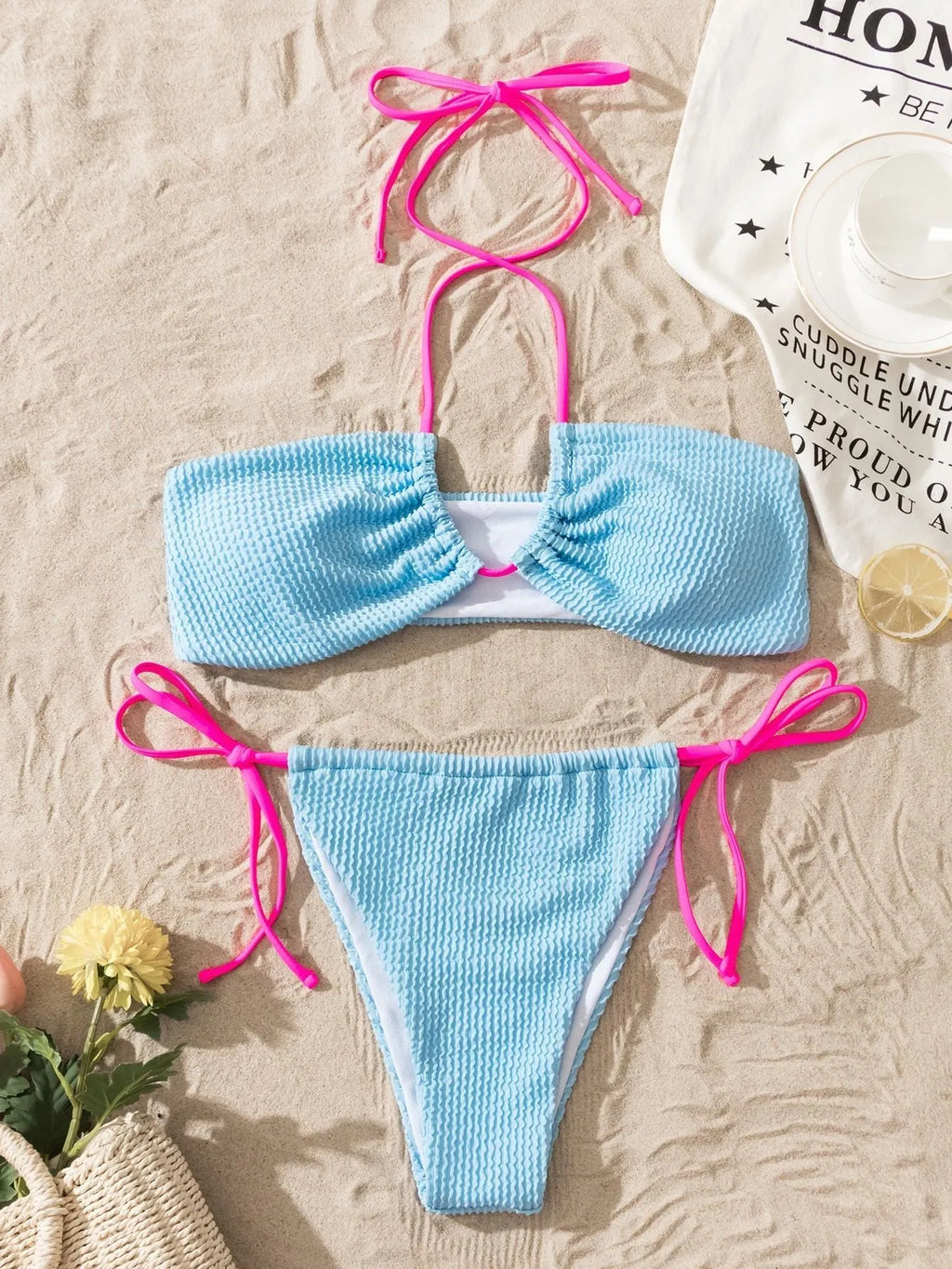 Women's solid colour separated swimsuit with halter neck and lace-up front, briefs style