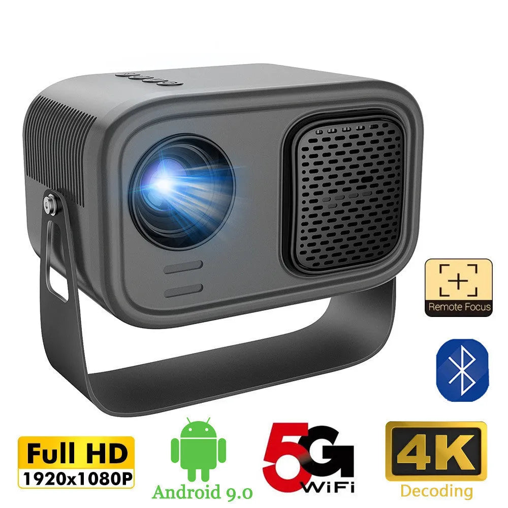 Black portable smart HD projector with remote control on a desk.