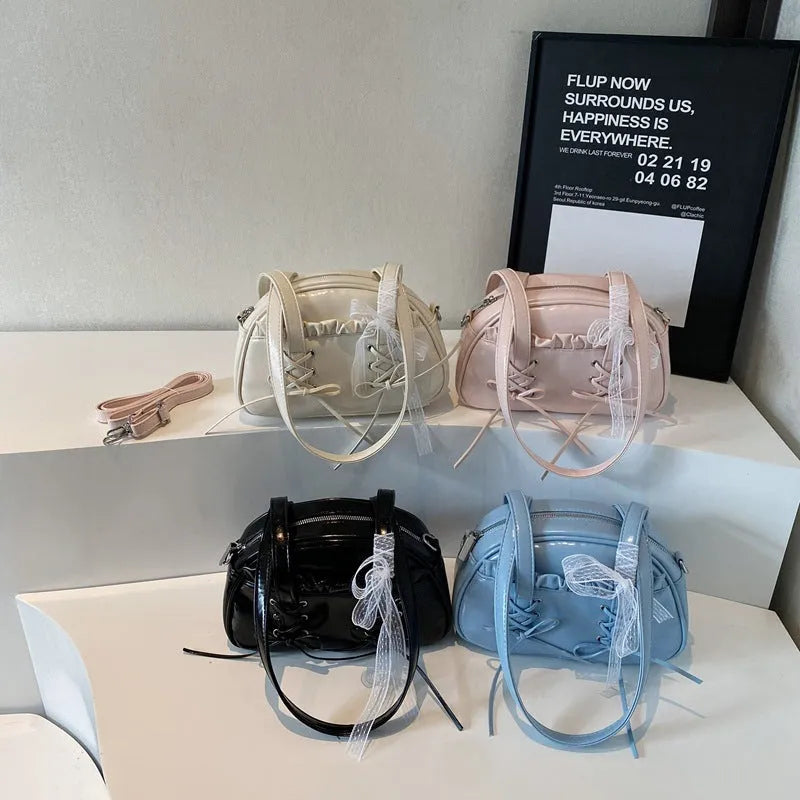 Women's bandage bow handbag in PU leather with shoulder strap and sewing thread detail