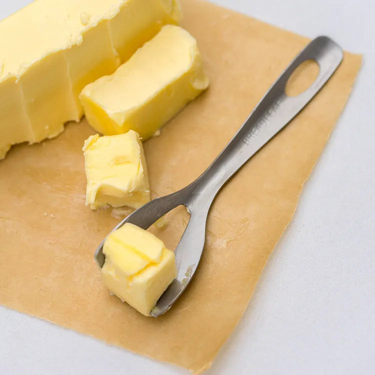 Stainless steel butter cutter with 12cm 304 stainless steel edged blade on a kitchen surface