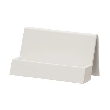 Creative PS geometric business card stand in brown, holding 20 cards upright on a desk.