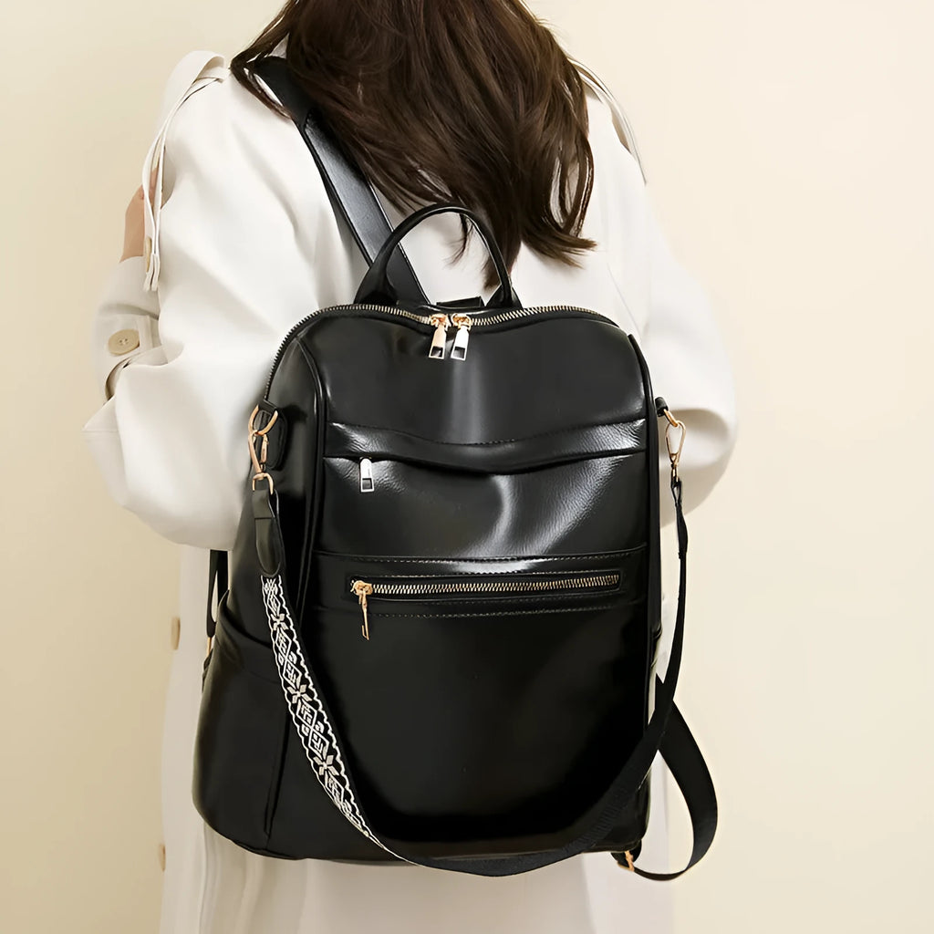 Retro PU backpack in black with multiple compartments, waterproof and wear-resistant, for daily use.