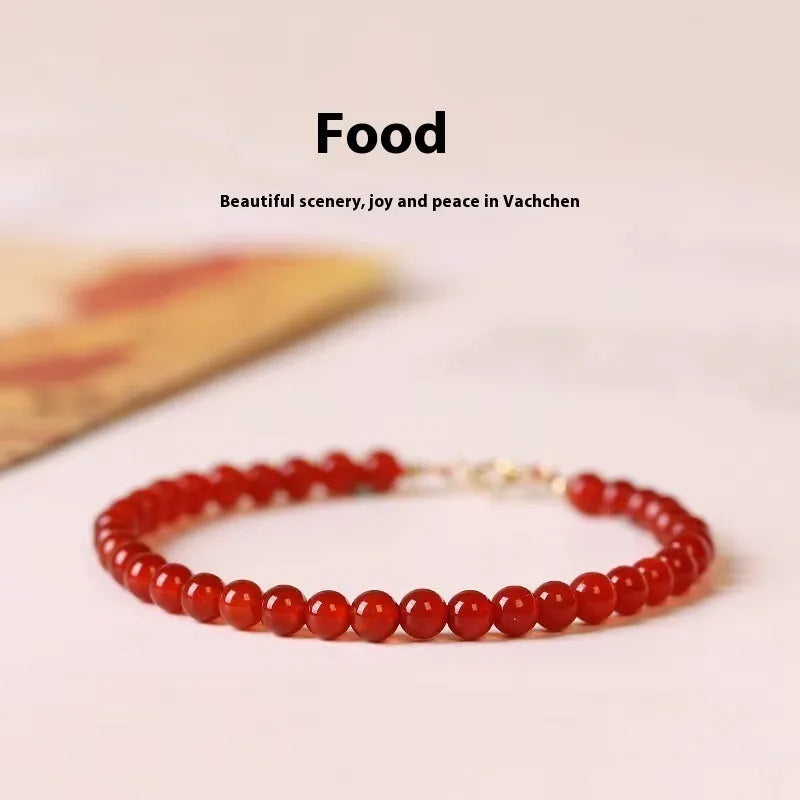 Ultra-thin red agate bracelet for women on a white background.