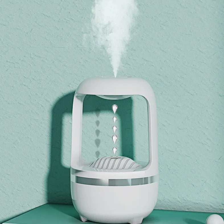 Black and white anti-gravity humidifier showing water droplet effect with USB cable