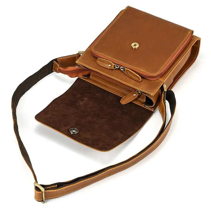 Men's brown leather shoulder bag with flip shoulder strap showing sewing line details and retro design