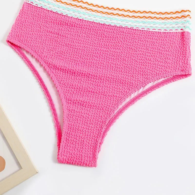 A pink high waist women's bikini brief with a split leg design, laid flat.