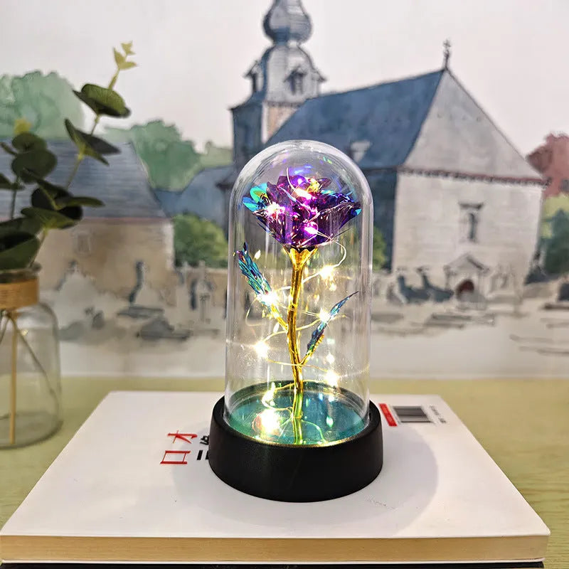 Glass cover small night lamp with plastic flowers in 15cm tall design with black base