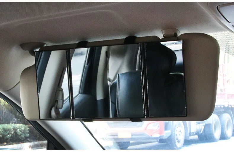 Silver folding car makeup mirror shown both closed and open on a car visor.