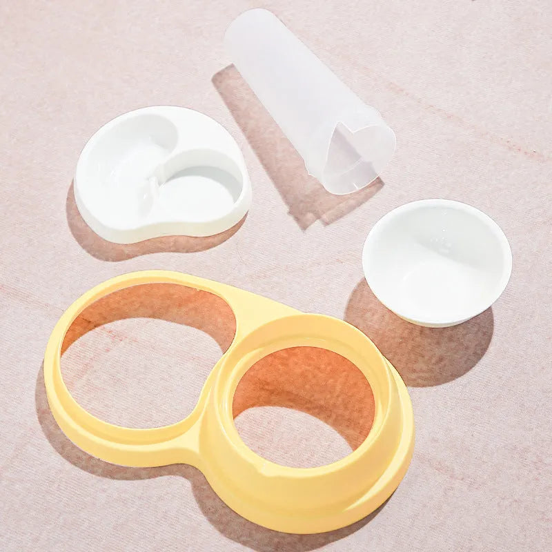 Grey and yellow double pet feeding bowl with ceramic food bowls and stainless steel water dish on a PP plastic base.