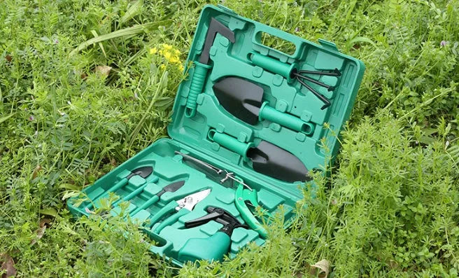 Ten-piece gardening tool set with iron heads and plastic handles in green colour