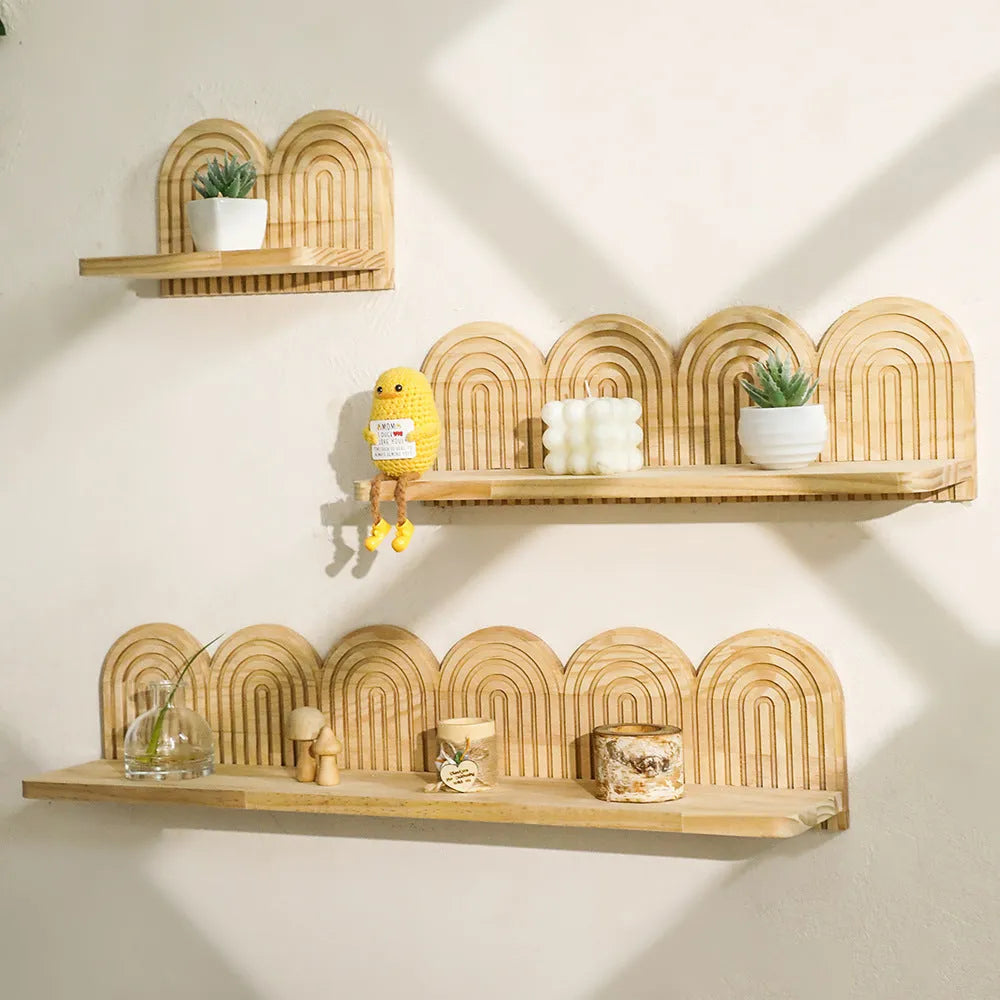 Solid wood multi-layer wall shelf holding several small potted plants.