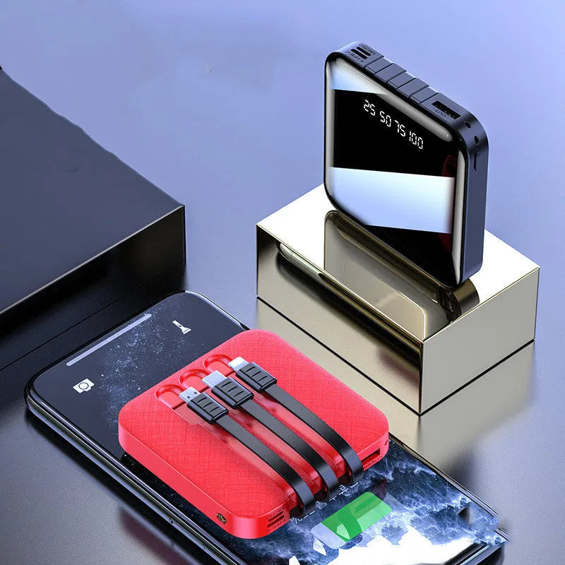 Black mirror-finish portable power bank with integrated charging cable.