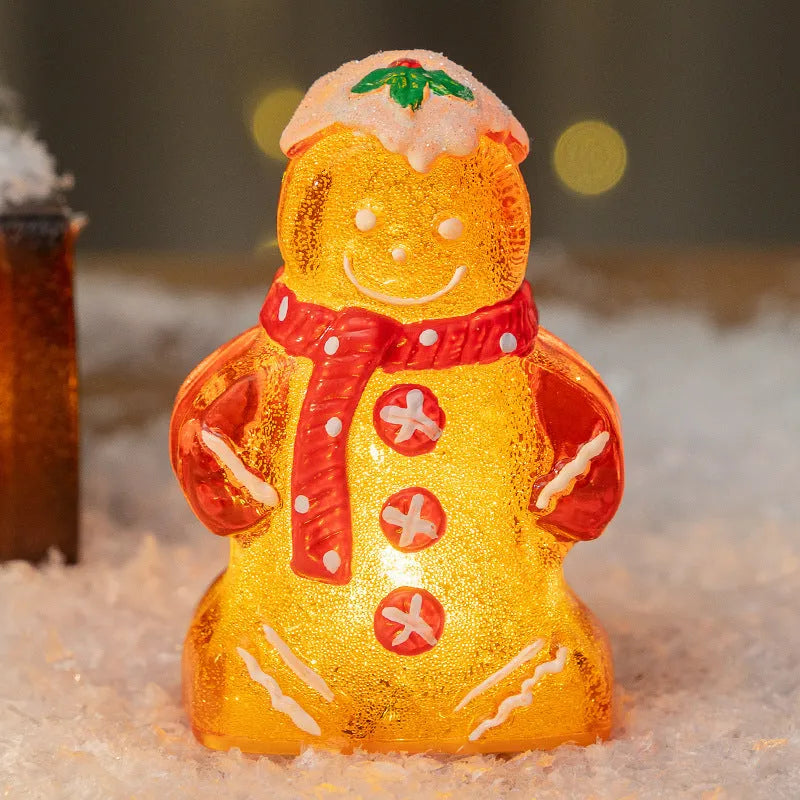 Glowing plastic gingerbread man Christmas ornament with LED light and scarf, in four colour variations.