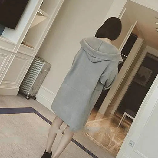A grey plus size women's loose thin coat with long sleeves and lace detail on a hanger.