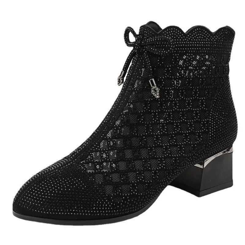 Black women's ankle boots with cutout mesh panels, mid heel, side zipper, and rhinestone sequin details