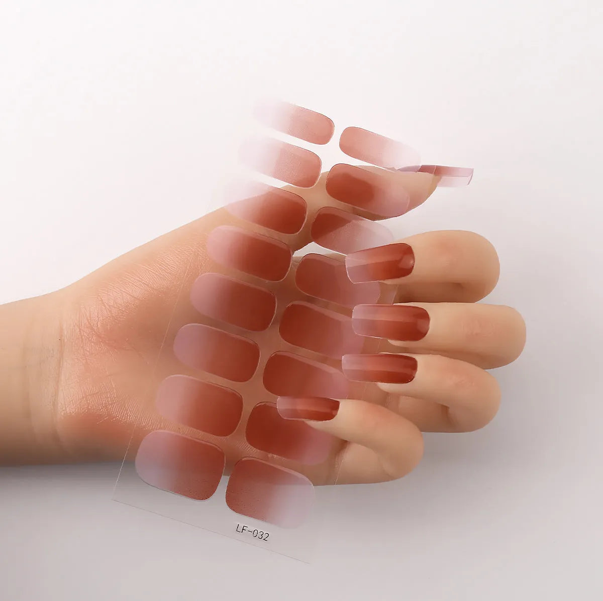 16 solid colour full nail art stickers with 22 patterns including cross, rose, butterfly designs in 12x6mm oval size