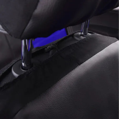 Black synthetic leather car seat cover installed on a front car seat, showing stitched design.