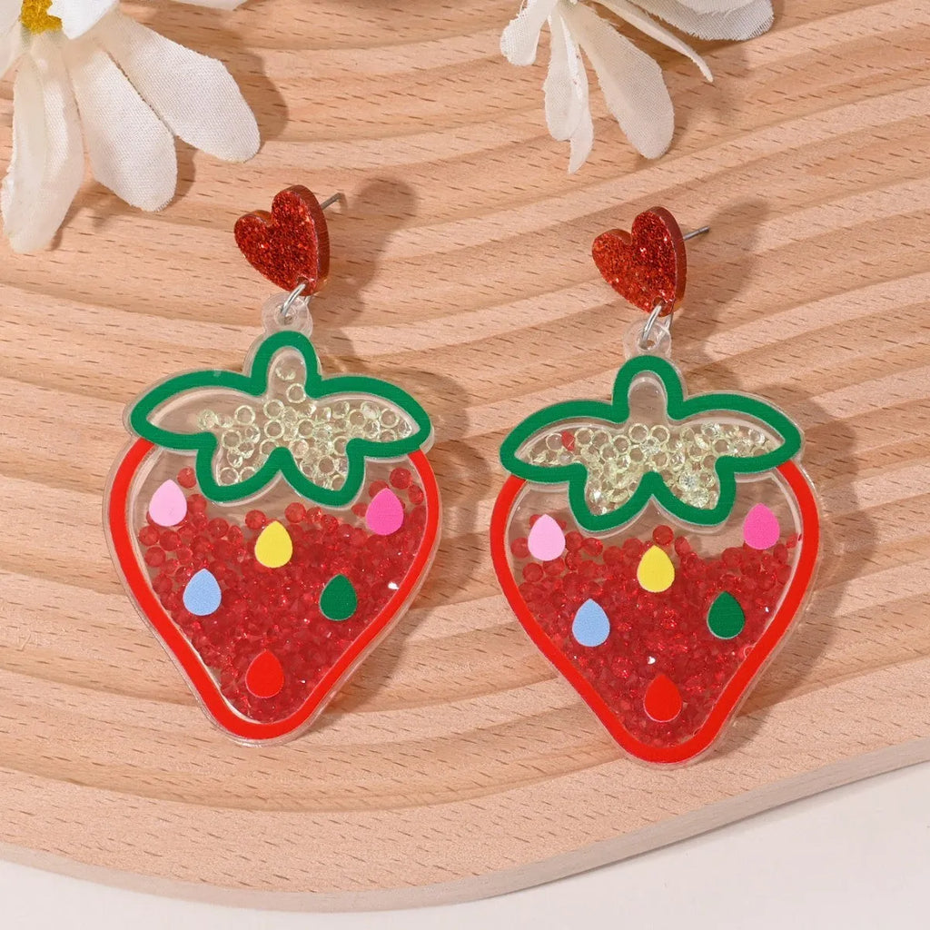 Colourful acrylic drop earrings with fruit and dessert charms including strawberry, cherry, pineapple, and watermelon.