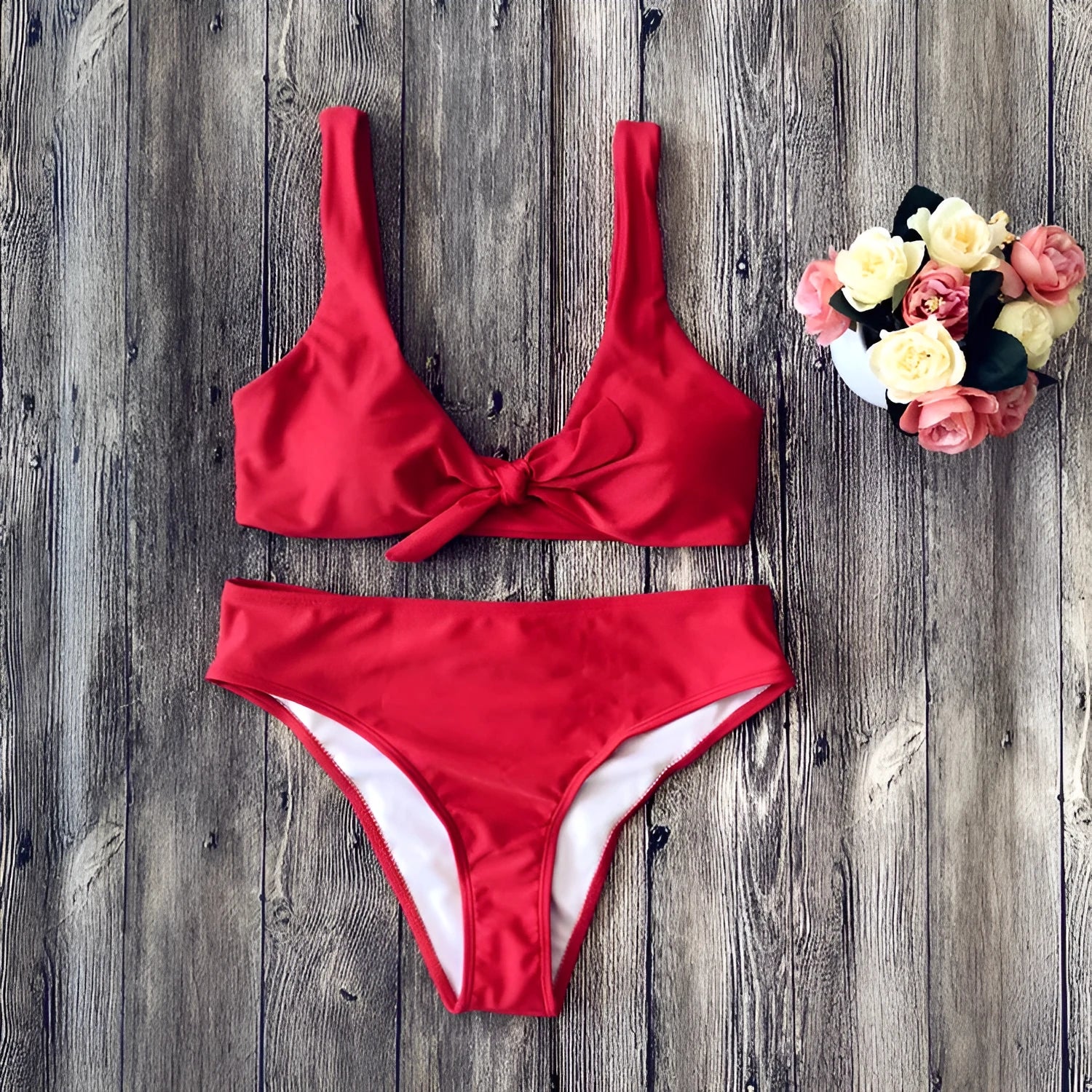 Women's solid colour bikini set showing bra top and briefs in black, pink, red, white, or wine red.