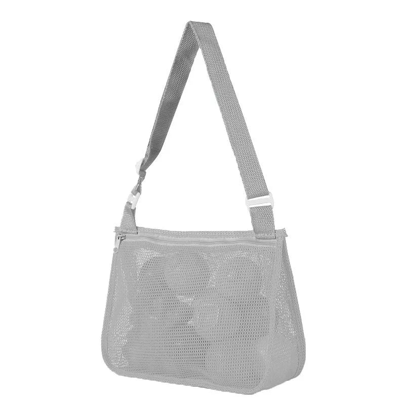 Blue nylon mesh travel storage bag with black handle and zip seal for children's clothing organisation