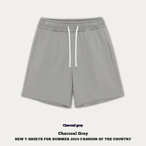 Loose-fit cotton denim shorts for baby or toddler in charcoal grey colour on a hanger.