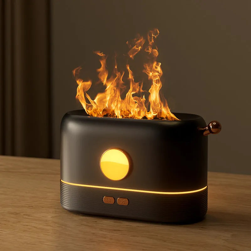 Black USB humidifier diffuser with flickering flame effect light and water mist on wooden desk
