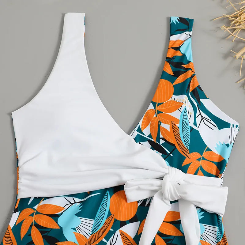 Women's high waist one-piece swimsuit in a printed pattern, shown in black and white colour options.