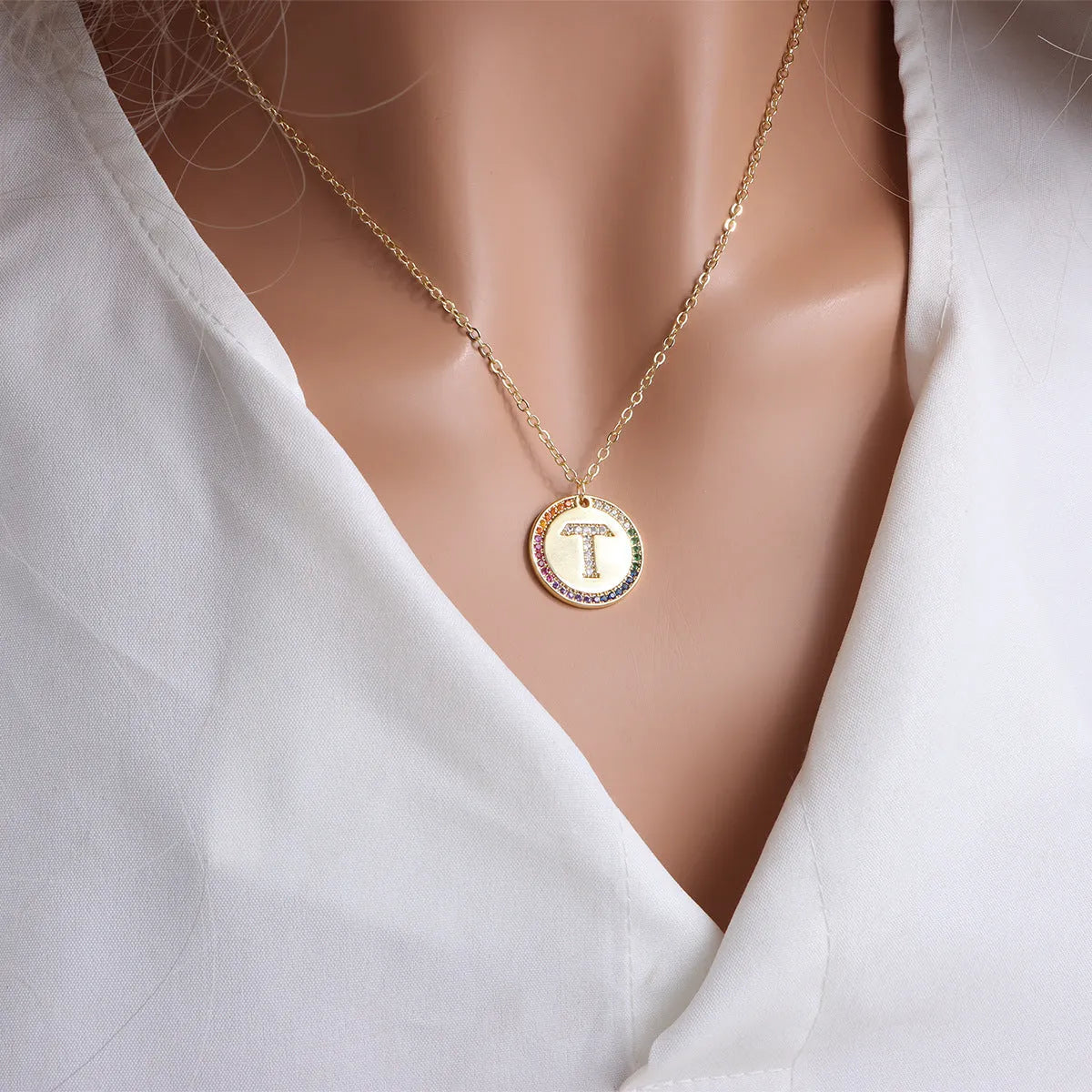 Gold English letter round pendant necklace with colourful crystals on clavicle length chain