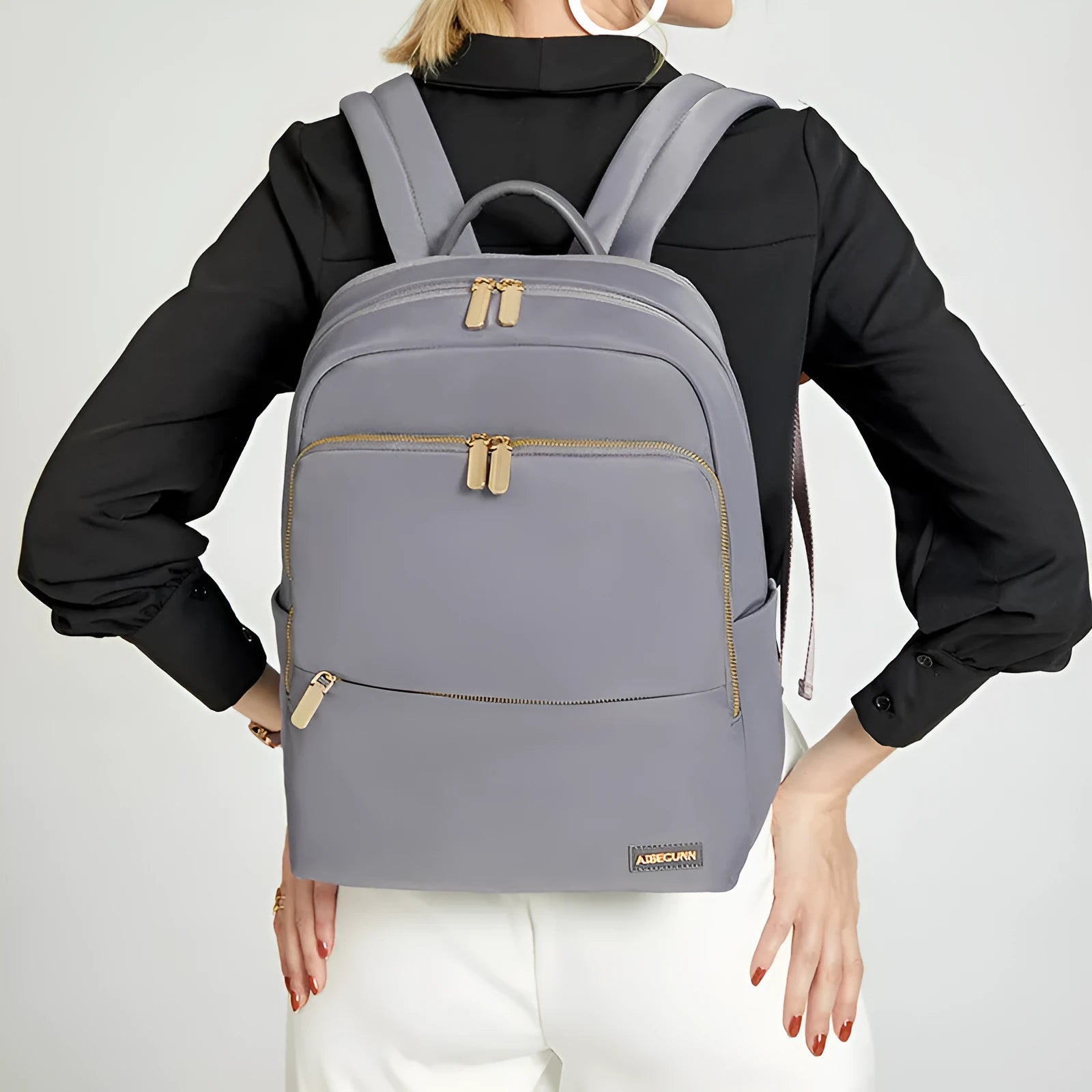 Women's large Oxford cloth backpack in black, showing front compartment and breathable back panel